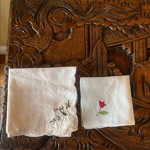 Two hand embroidered handkerchiefs left pink 10.5” square, white 8” square